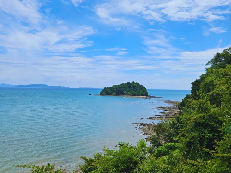 Sea, rocky coast and little island in the distance, Koh Lanta