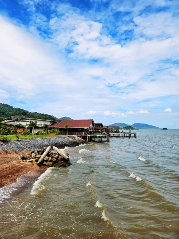 Seaview from Koh Lanta Old Town Pier, houses on stilts and big waves
