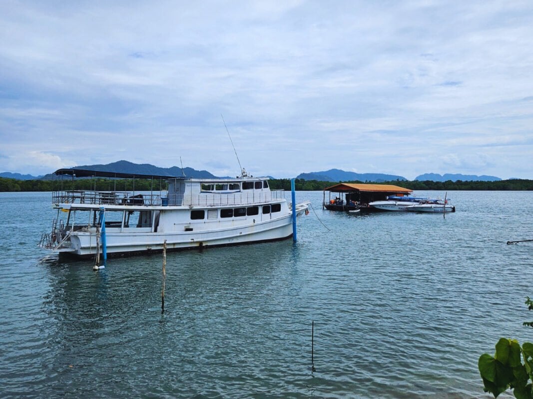 Ship on the sea, mountains in the distance Koh Lanta