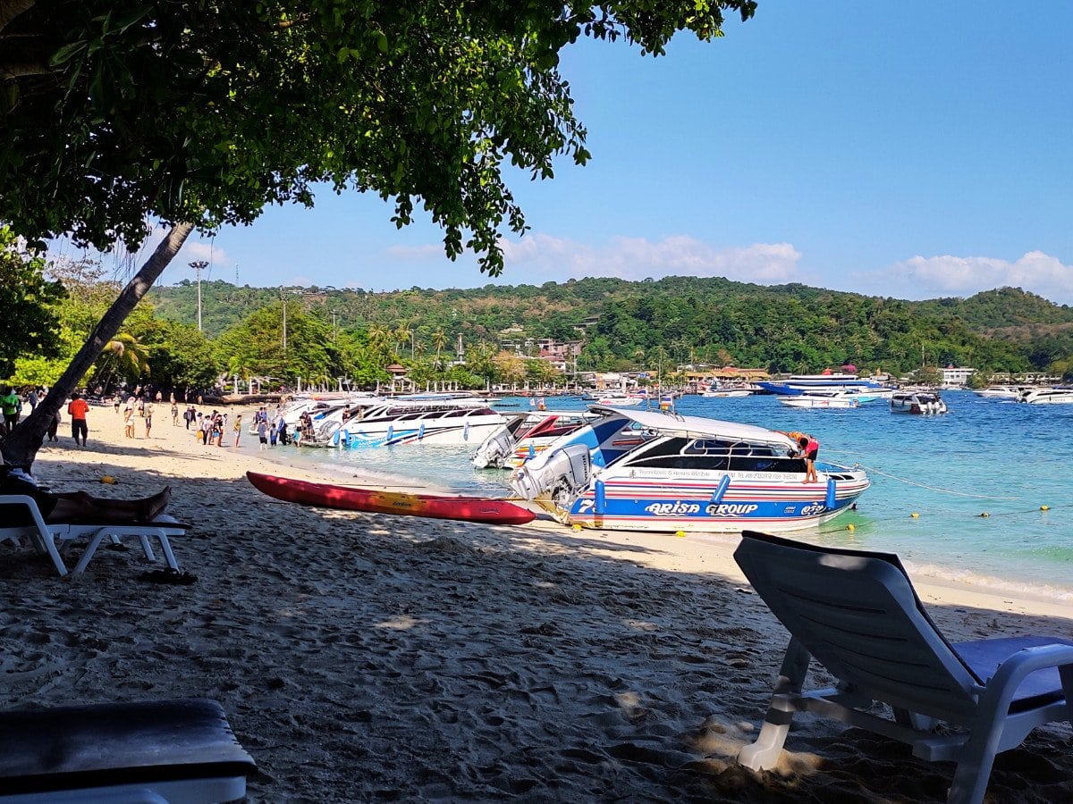 Speedboats parked on Tonsai Beach in Koh Phi Phi, a common arrival point for ferries and island transfers in Southern Thailand.