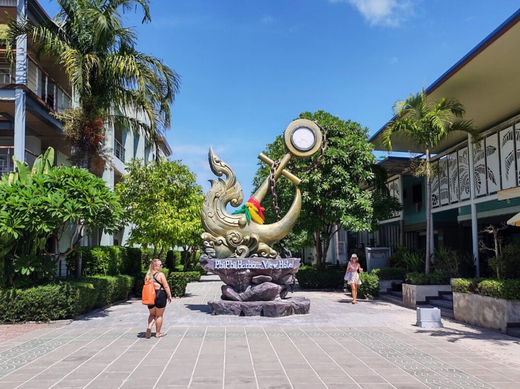 People walking and the sculpture on the Koh Phi Phi tonsai village