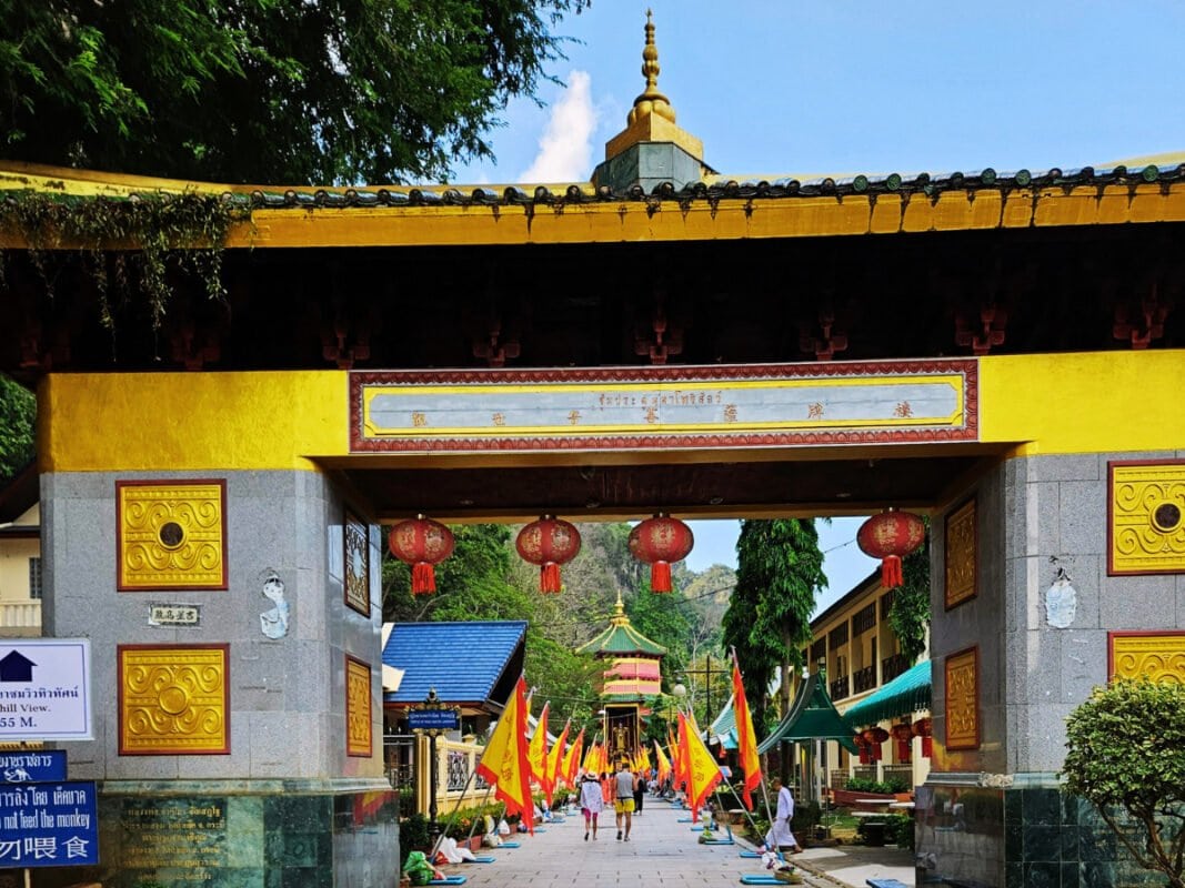 People visiting tiger cave temple during chinese new year, colorful decorations