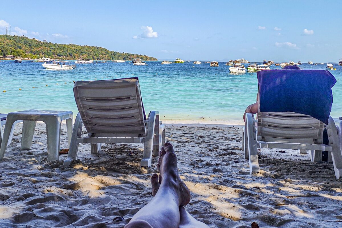 Tonsai Beach Koh Phi Phi sunbeds boats shoreline main beach near pier