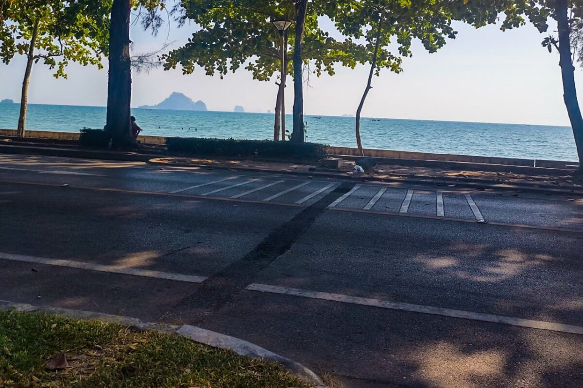 Beachfront road in Ao Nang with views of the Andaman Sea and limestone islands in Krabi, Thailand