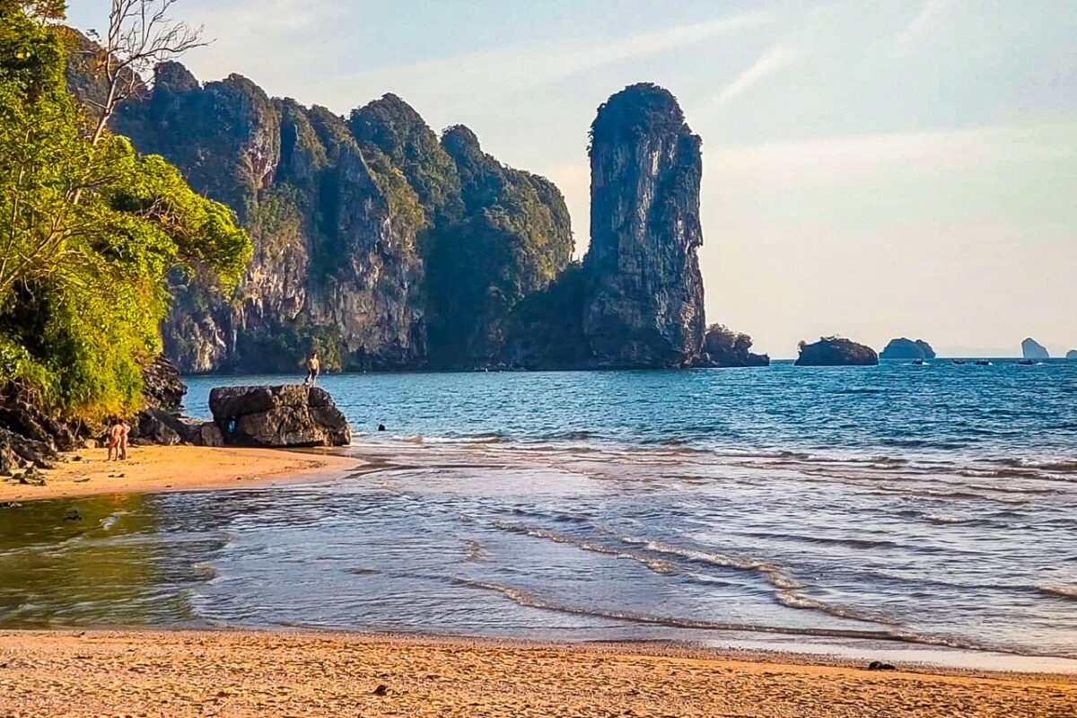 Ao Nang beach with limestone cliffs and clear water in Krabi Thailand