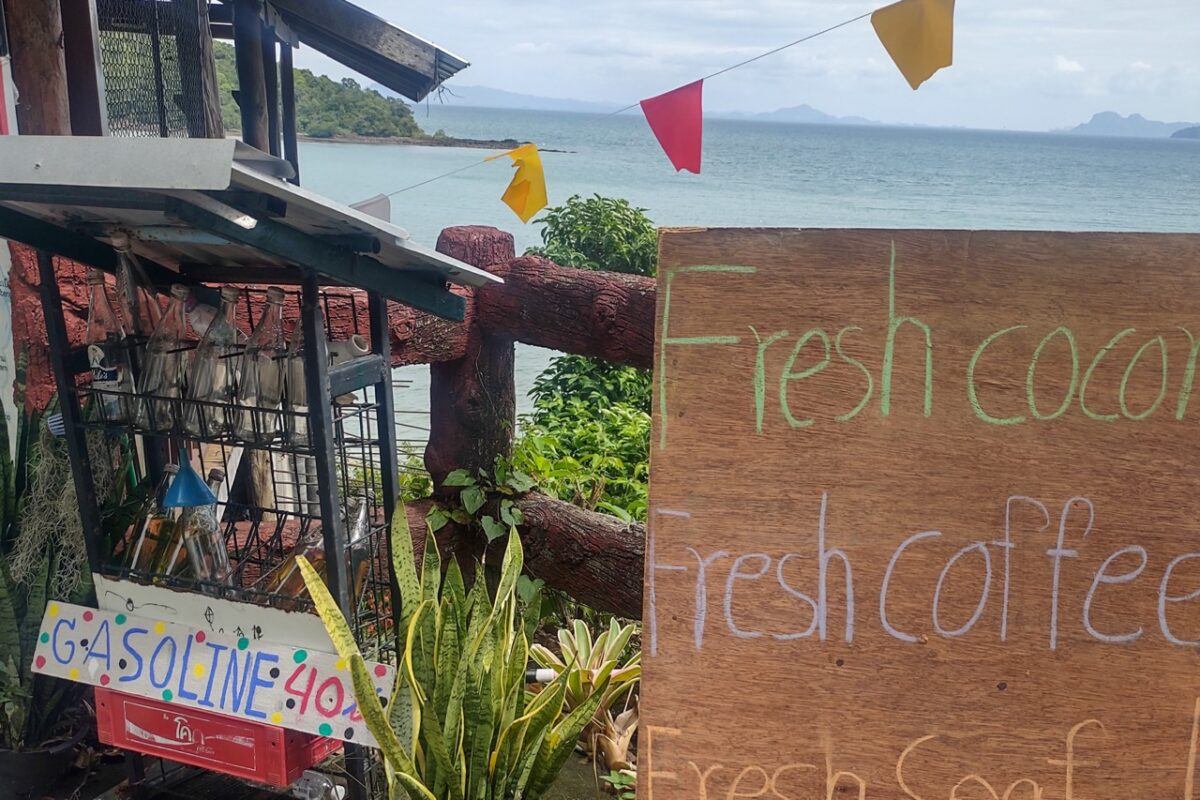 Roadside stall selling gasoline in glass bottles on Koh Lanta east coast in Thailand