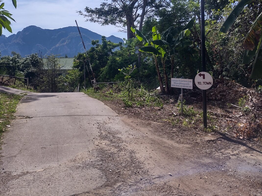 Small village road with tropical hills on Koh Phi Phi Don in Thailand