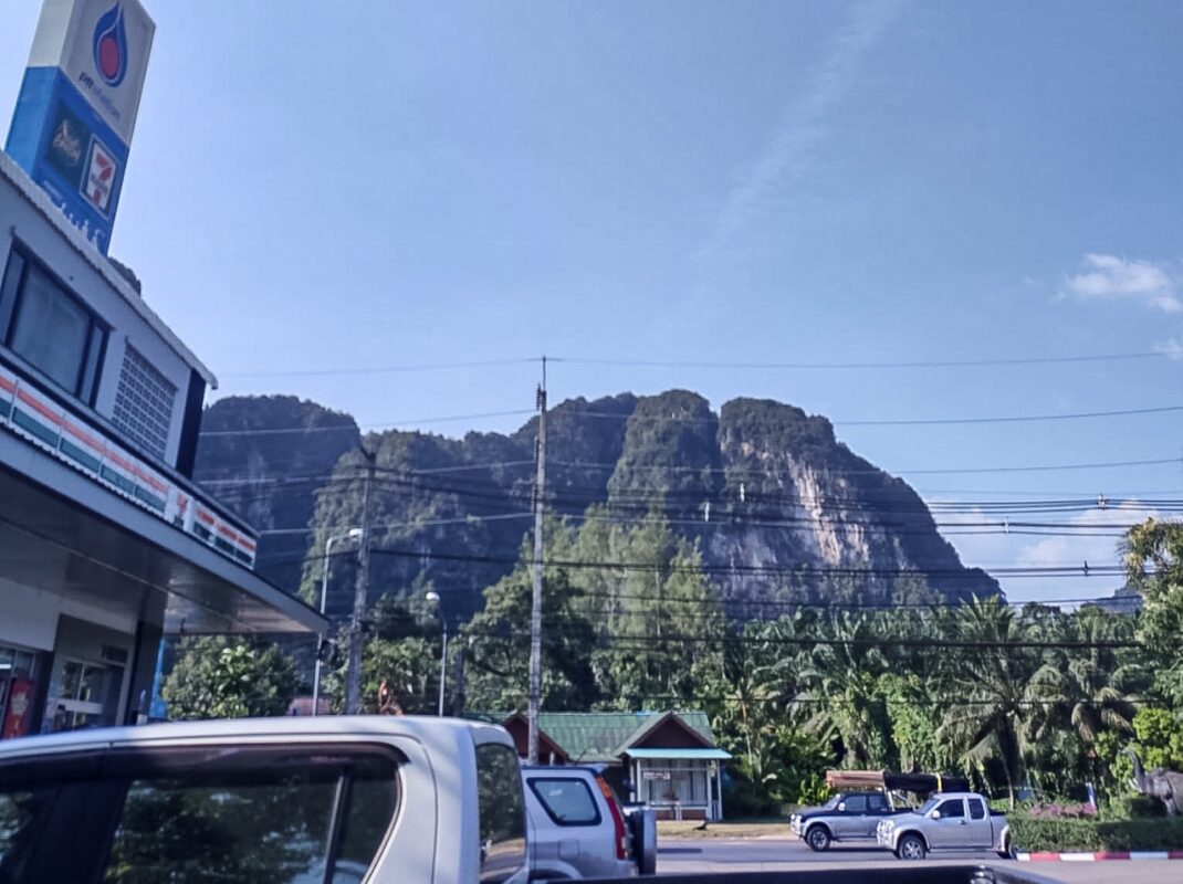 Gas station in Krabi town with limestone mountains in the background in Southern Thailand