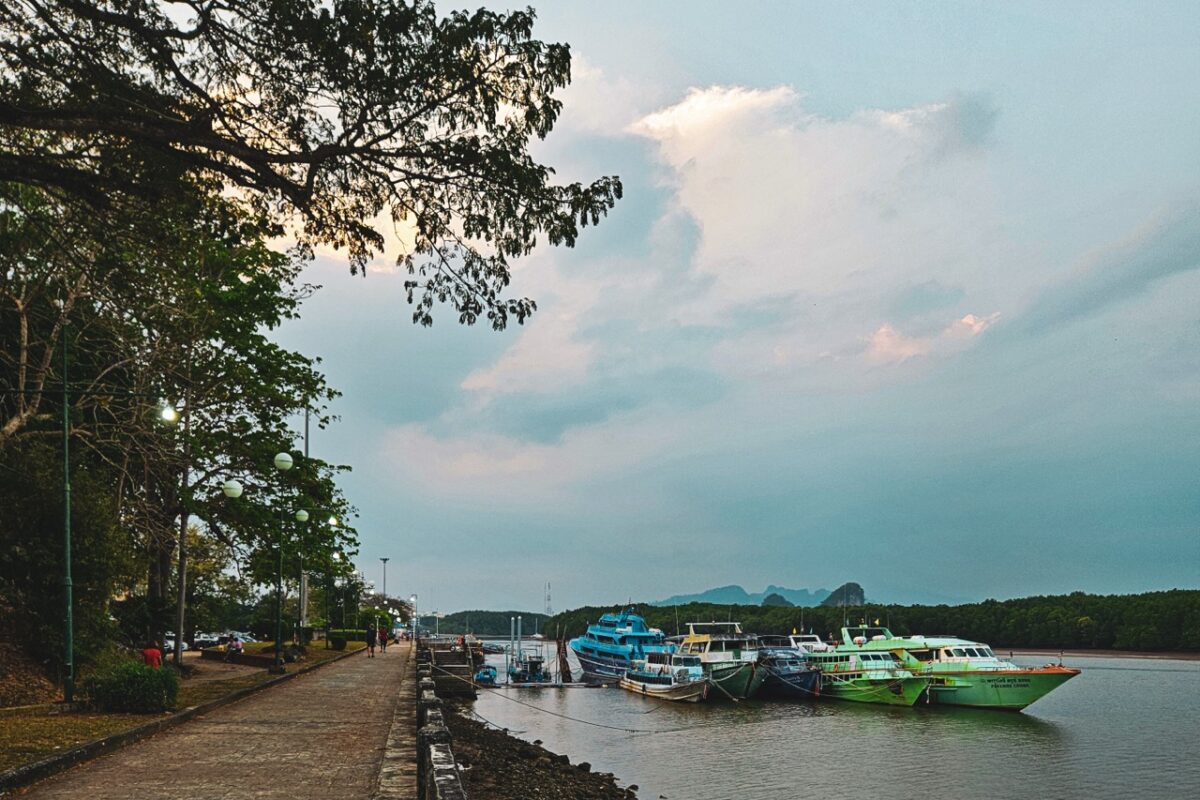 ferries and boats docked at krabi town river in southern thailand