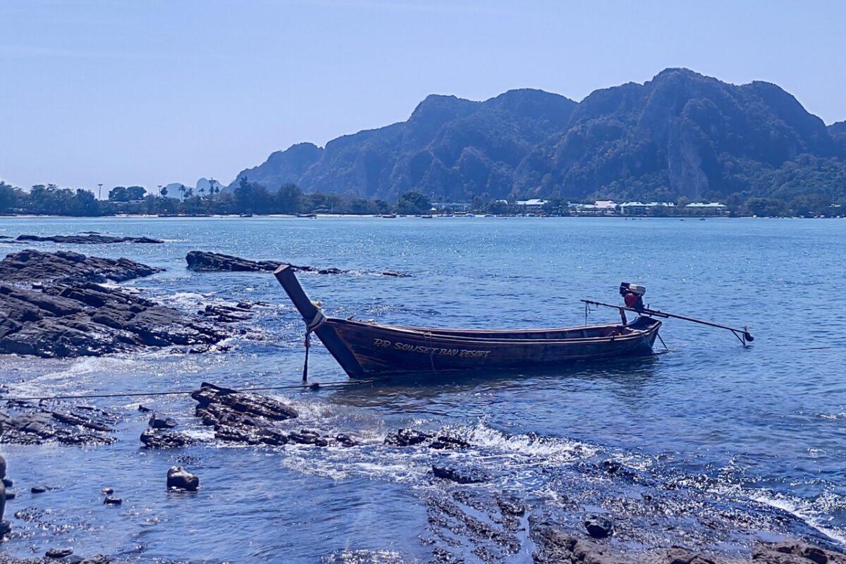 traditional longtail boat near the coast of koh phi phi in southern thailand