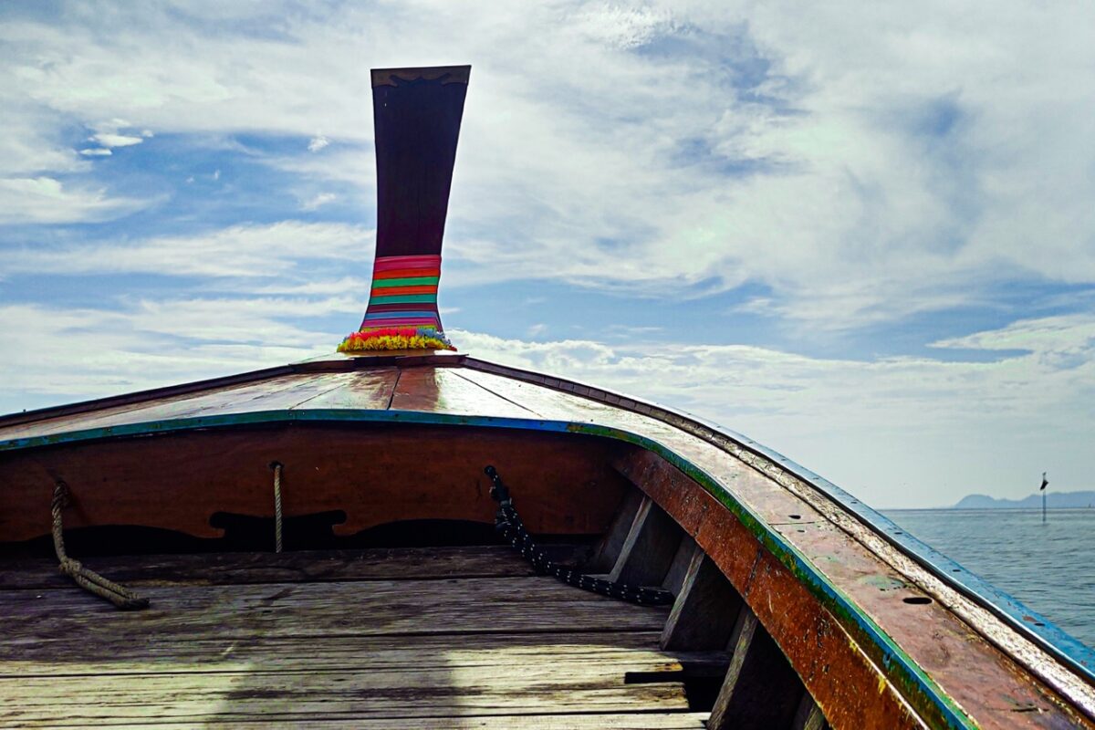 view from traditional thai longtail boat in trang islands thailand
