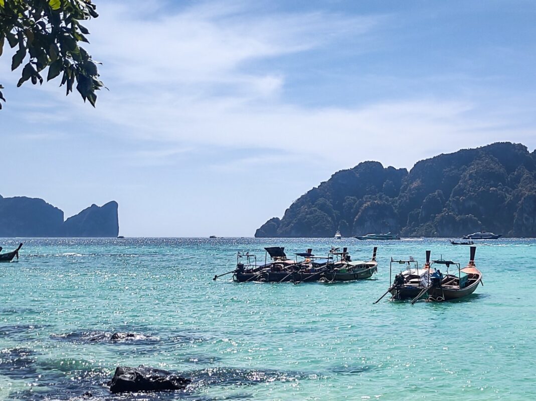 longtail boats floating in the andaman sea near koh phi phi thailand