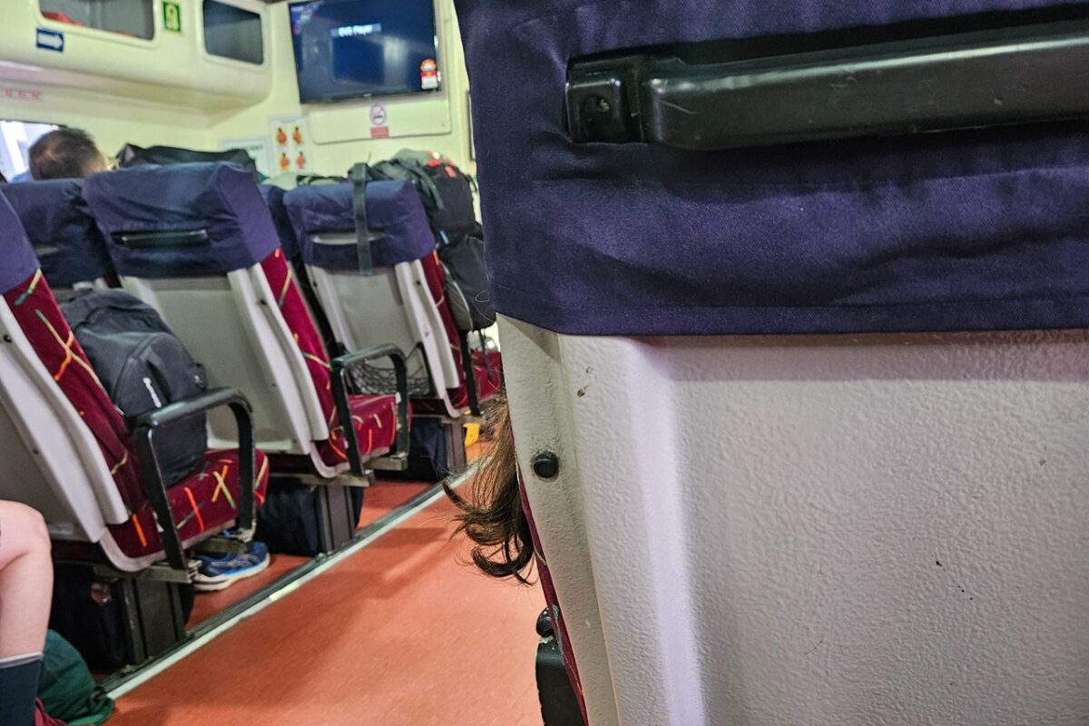 Interior seating area inside a passenger ferry traveling from Langkawi to Koh Lipe between Malaysia and Thailand.