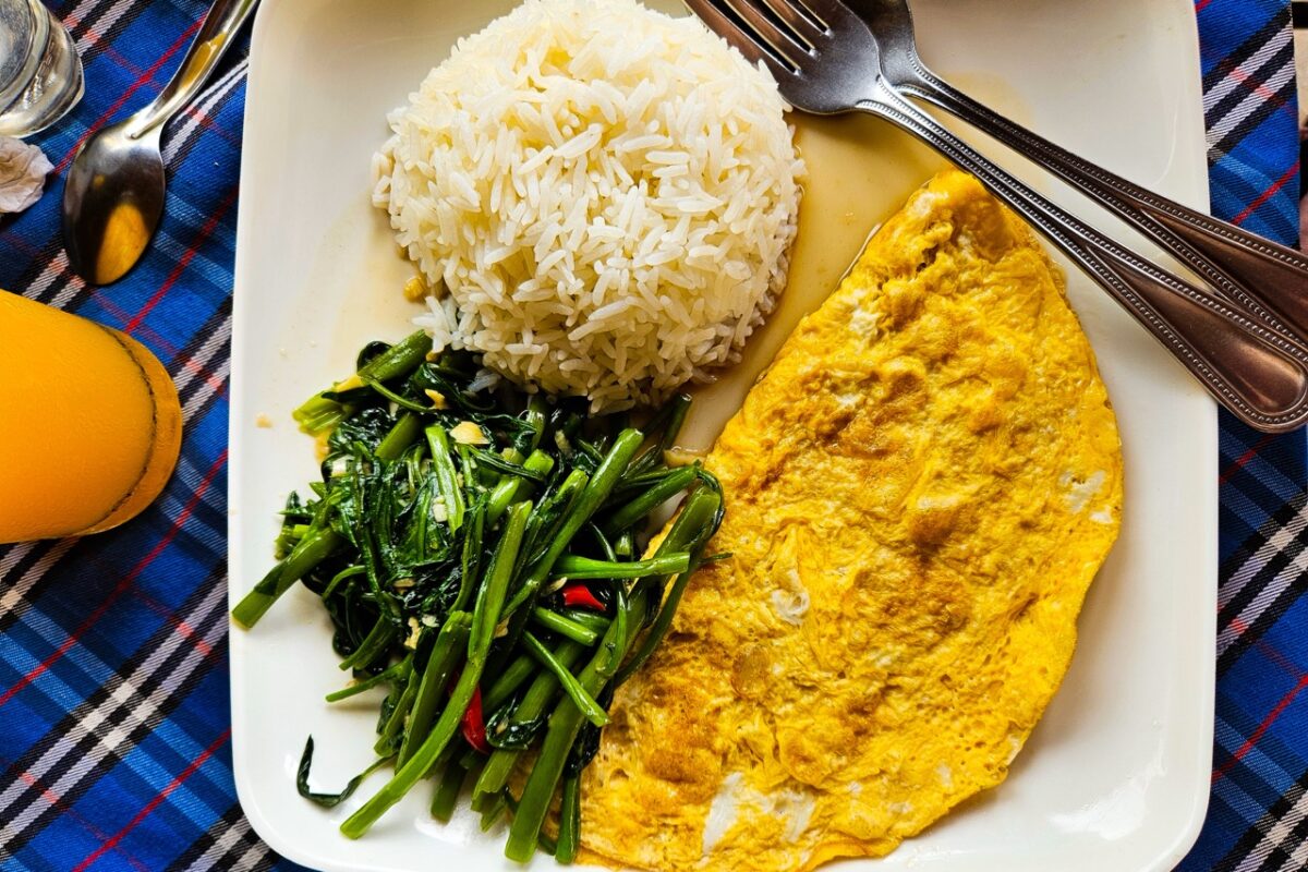 Simple Thai meal in Koh Phi Phi with rice omelette and stir fried vegetables