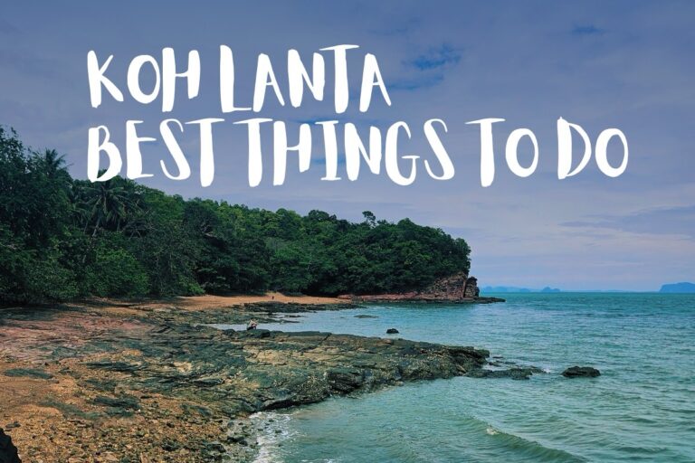 View of the rocky shore and sign Best Things to Do on Koh Lanta