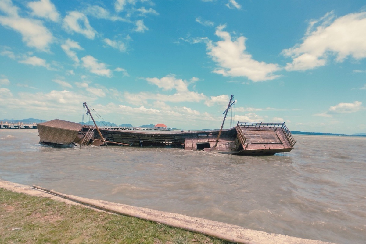 Wooden shipwreck beside the pier in Koh Lanta Old Town