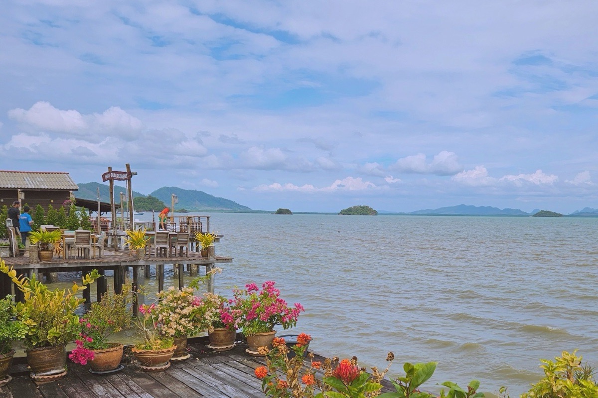 Waterfront restaurant and colourful flowers in Koh Lanta Old Town